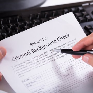 background check service truthfinder cost price completing request for criminal background check with pen on paper